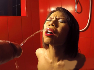 Teen ladyboy mouth pissing and sucking a his big white cock in the shower