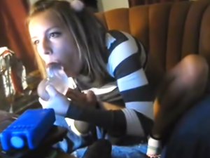 Blonde is sucking on a large dildo