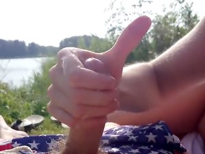 Girl is handling cock by the river